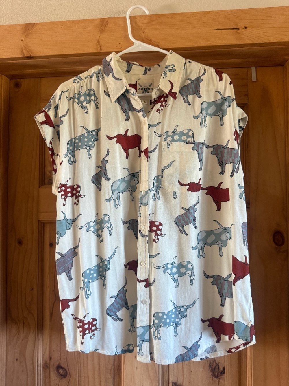Cow print button down top size large
